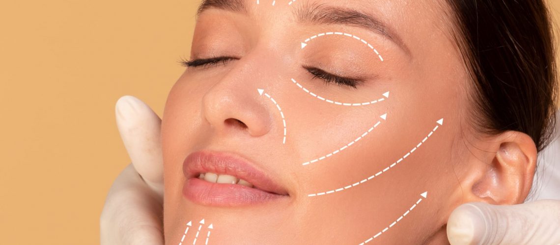 beauty-treatment-concept-young-woman-receiving-face-massage-from-cosmetologist-cropped